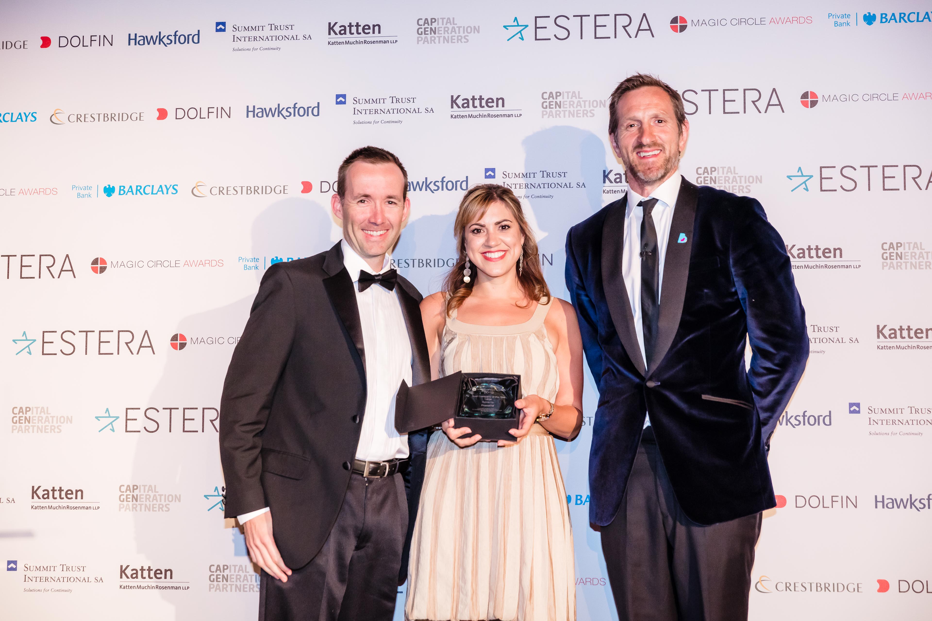 3 employees posing with their award at the City Wealth Magic Circle Awards