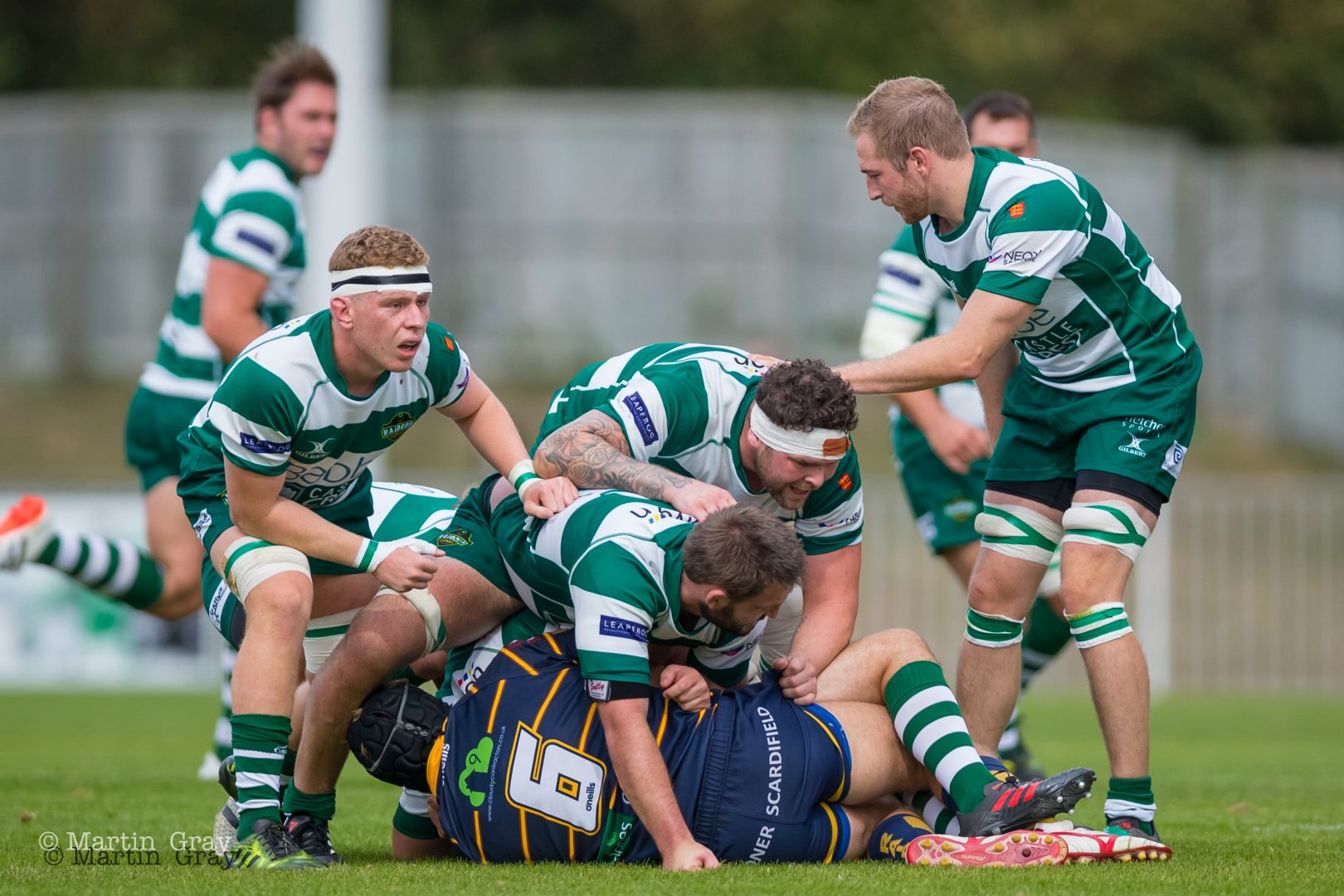 Action shot of the Guernsey Raiders tackling the opposing team