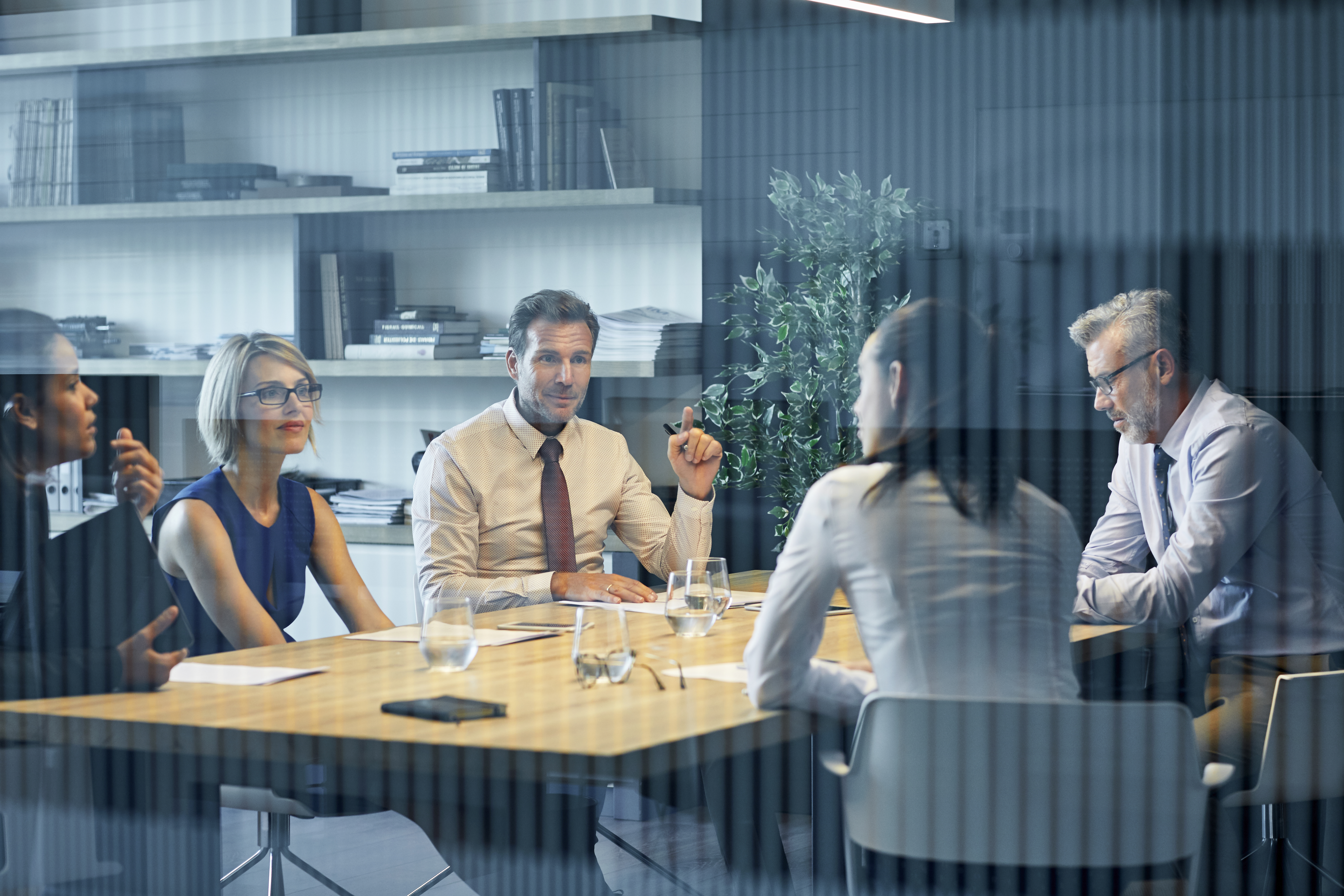 Boardroom Meeting Seen Through A Glass Window | Praxis