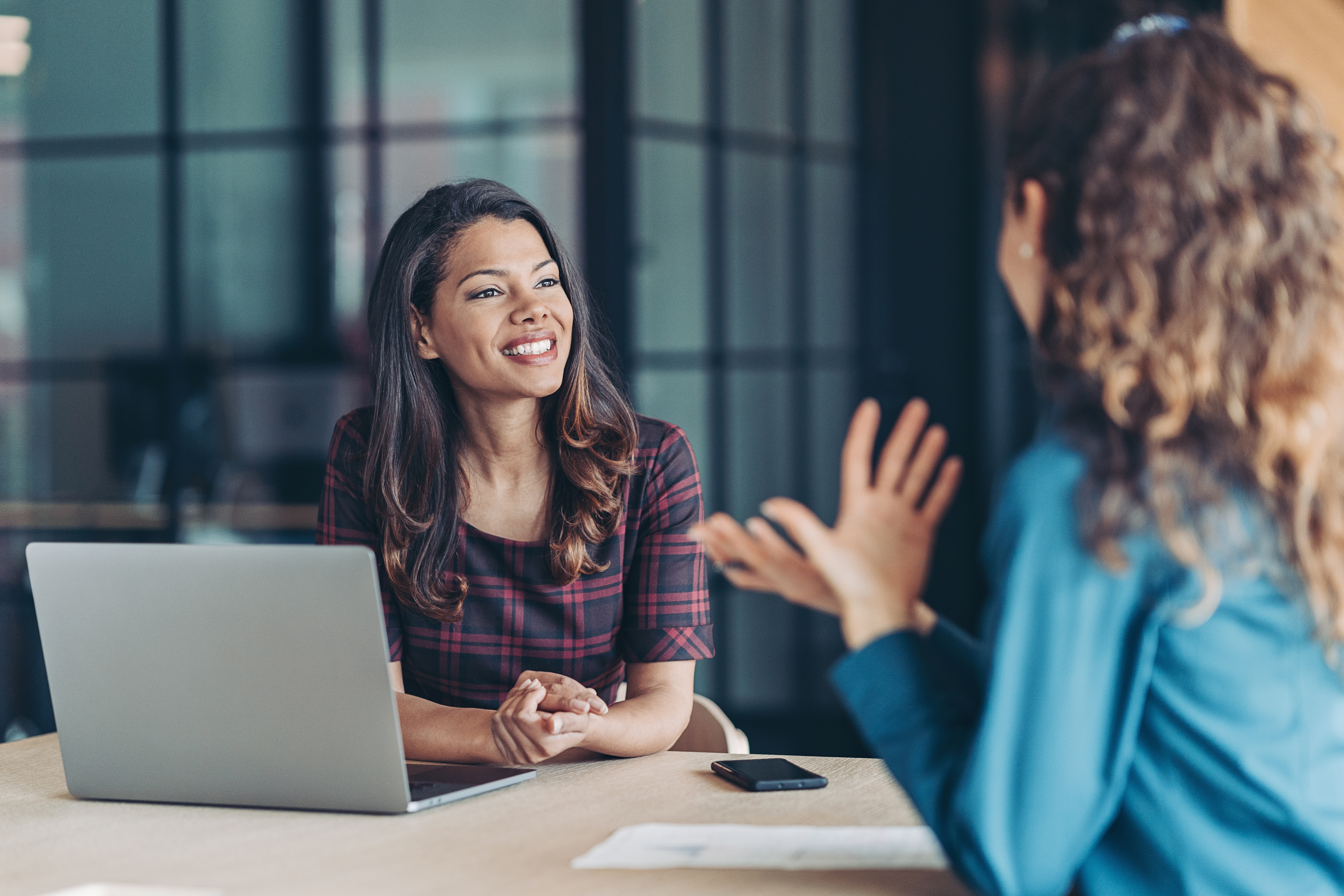 Two Women in a Meeting | Praxis