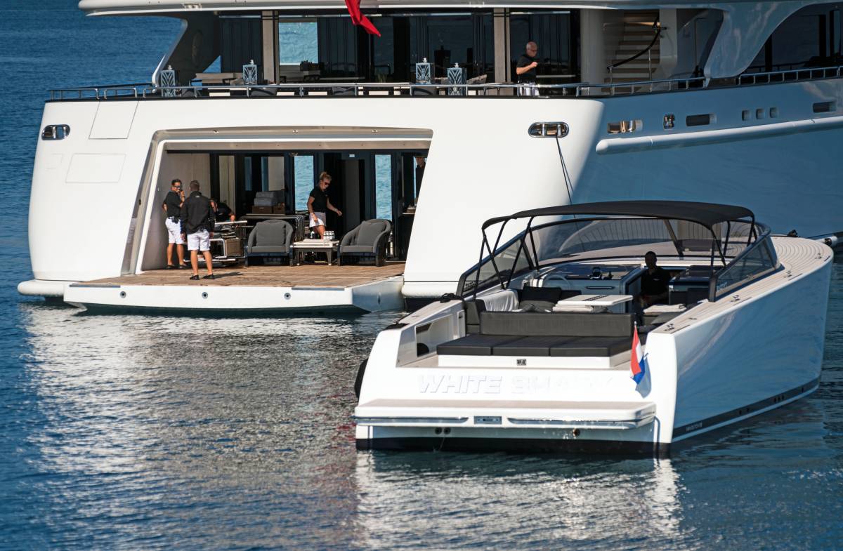 Superyacht Crew With Launch Craft At Sea