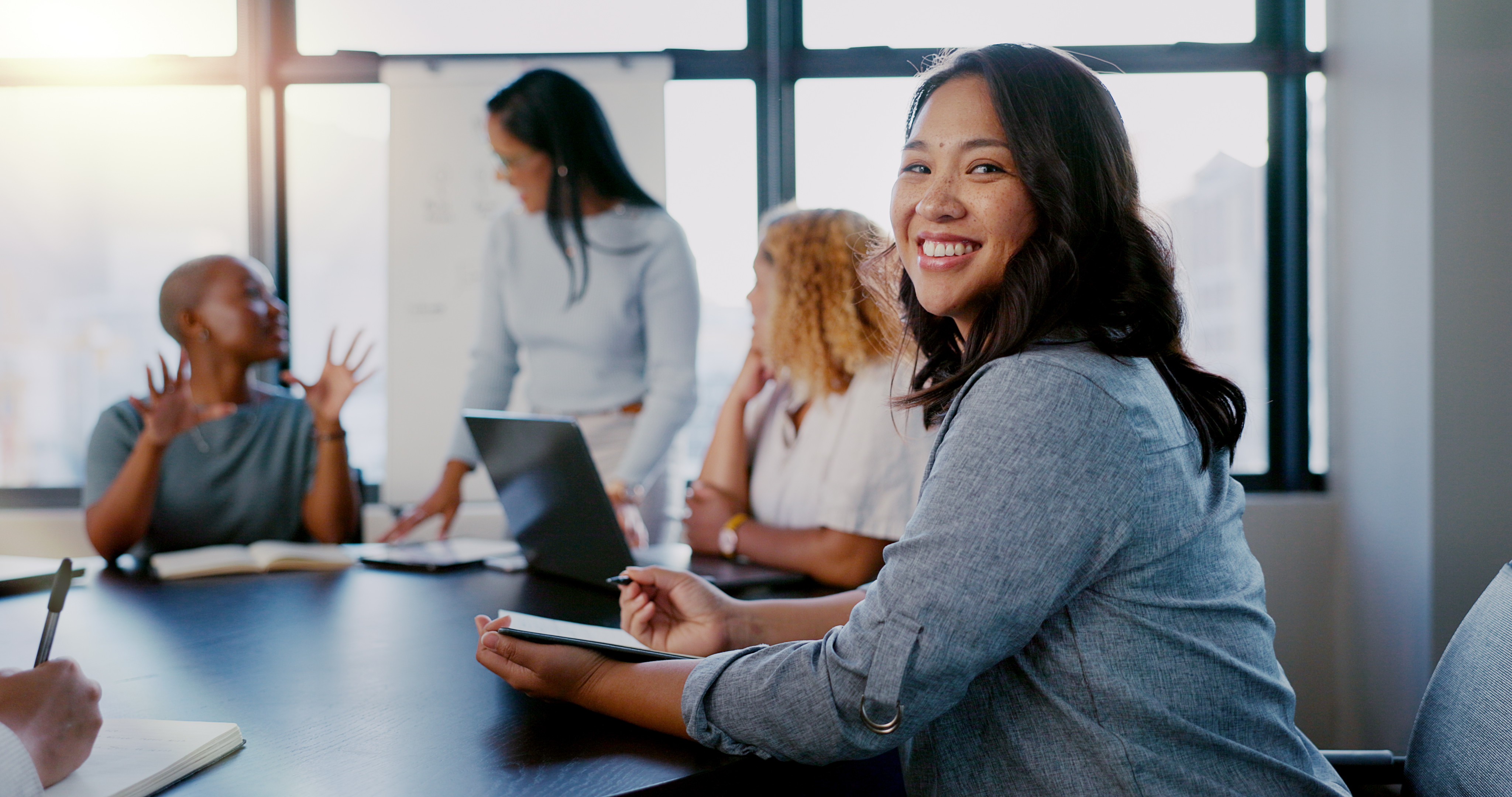 Group Of Women In A Meeting Smiling